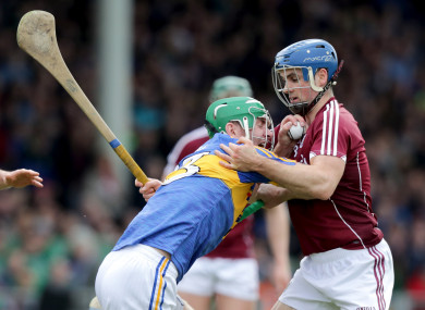 Noel McGrath and Johnny Coen in action in last year's hurling league final.