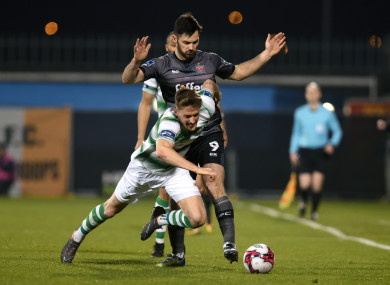 Dundalk’s Pat Hoban and Lee Grace of Shamrock Rovers in action.