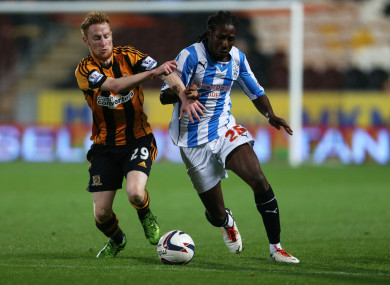 Carr, in action for Huddersfield, against Hull's Irish midfielder Stephen Quinn in 2013.