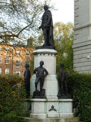 The statue is still in place on the grounds of Leinster House.