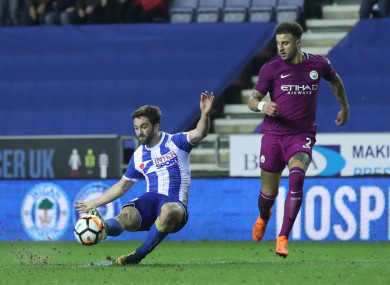 Grigg struck in the second half to send Wigan through.