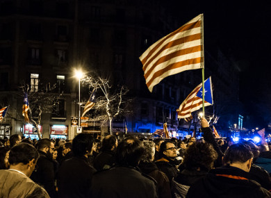 Demonstrators hold Catalan flags in a demonstration in Barcelona this week.