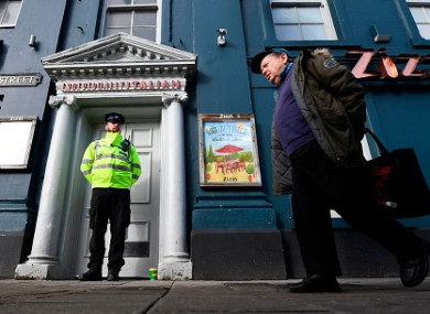 A poice officer stands guard outside a branch of the Italian chain restaurant Zizzi close to The Maltings shopping centre in Salisbury.