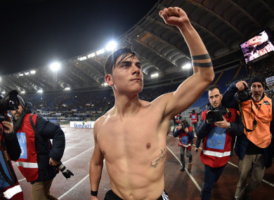 Dybala celebrates scoring a 93rd minute winner at the Stadio Olimpico.