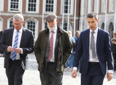 Brian Purcell (middle) on his way into Dublin Castle