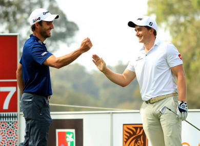 Dunne celebrates his ace with playing partner Edoardo Molinari.