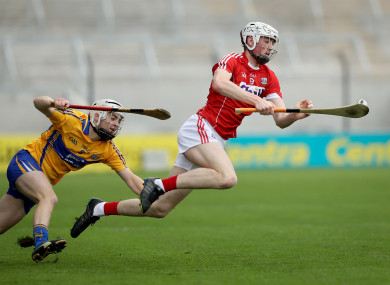 Clare's Fionn Slattery with Paul Cooney of Cork.