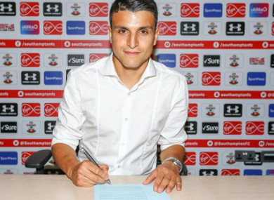 Elyounoussi signing the deal.