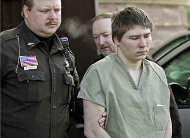 Brendan Dassey being escorted out of a Manitowoc County Circuit courtroom in Wisconsin in March 2006