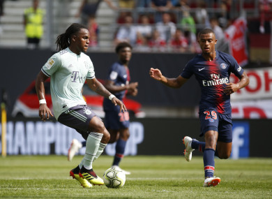 PSG's Antoine Bernede and FC Bayern Munich's Renato Sanches (L) vying for the ball.