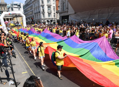 People take part in the Pride in London Parade in central London