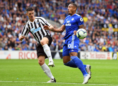 Newcastle United's Ciaran Clark (left) and Cardiff City's Kenneth Zohore battle for the ball.