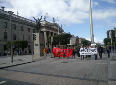 A group of housing protesters travel along O'Connell Street