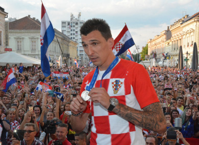 Mario Mandzukic shows off his World Cup runners-up medal at Croatia's homecoming last month.