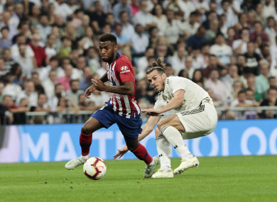 Atletico Madrid's Thomas Lemar gets away from Gareth Bale of Real Madrid during last night's La Liga fixture.