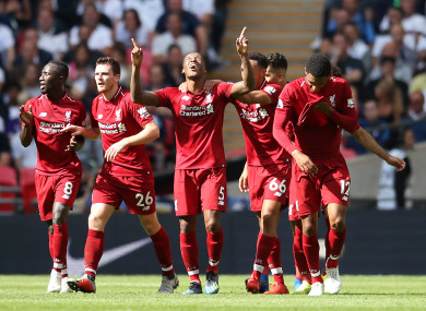 Liverpool's Georginio Wijnaldum (centre) celebrates scoring his side's first goal of the game.