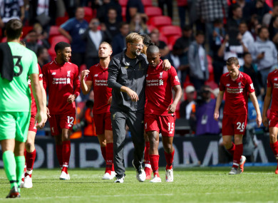 Klopp celebrates Liverpool's win at Wembley with his players.