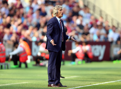 West Ham boss Manuel Pellegrini watches on from the sidelines.
