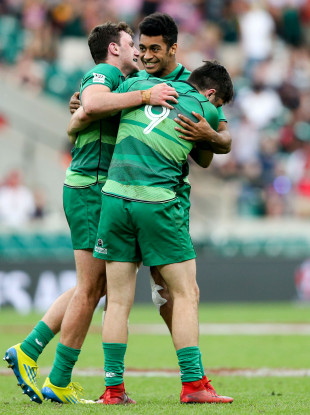 Robert Baloucoune, centre, celebrates Ireland's win over England at the Twickenham Sevens.