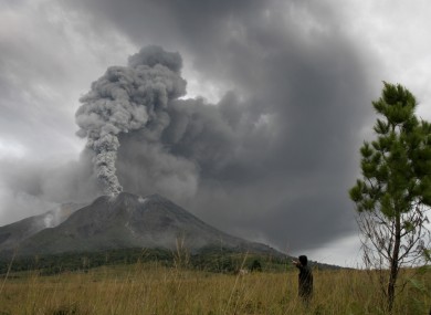 Mount Sinabung spews volcanic materials into the sky in Karo, North Sumatra, Indonesia, today.