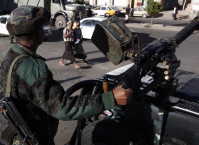 A Yemeni soldier mans a heavy machine gun on top of an army vehicle at a check point in the capital San'a, Yemen, earlier this year.