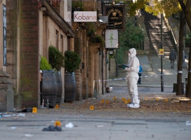 Police forensic officers examine the scene on Packer Street in Rochdale after a car drove into a group of people outside a crowded nightclub.