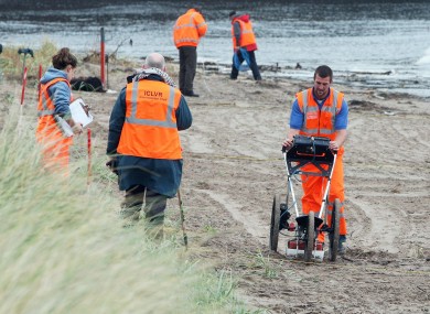 Forensic offers on the beach at Waterfoot in Co Antrim, where the search for Peter Wilson uncovered a human body earlier today.
