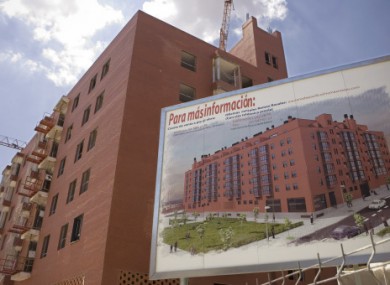 Photo from 15 July, 2008, showing a sign displaying apartments for sale is seen at the building construction site in Madrid.