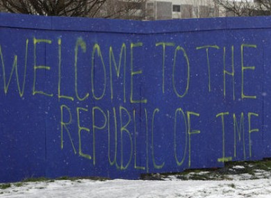 Graffiti on hoardings in Ballymun, Dublin, following the EU/IMF bailout agreement.