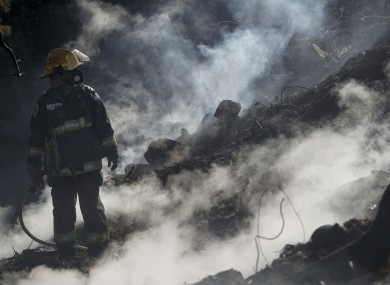 A firefighter takes a break as he tackles a blaze near Haifa, northern Israel.