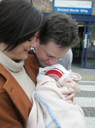 Nick Clegg kisses the forehead of his newborn son, Miguel, in February 2009.
