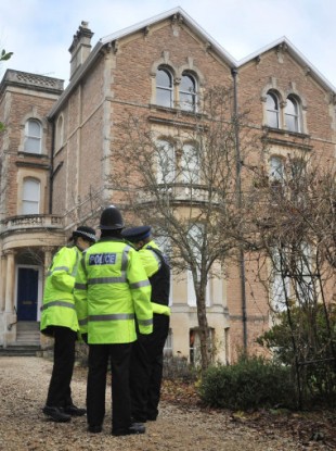 Police outside the building in Briston where Chris Jefferies and Joanna Yates lived in separate residences.