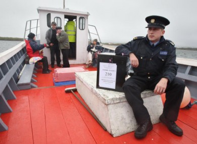 Garda Brendan McCann takes a ballot box to Inishfree Island in September 2009 during the Lisbon Treaty referendum.