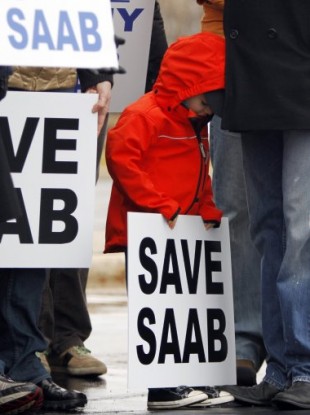 Jesper Hjertstedt, 4, of Milwaukee, Wisconsin, holds a sign during save Saab rally in Illinois in January 2010.