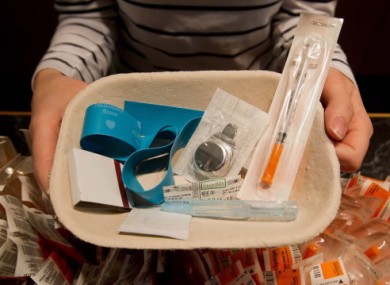 A nurse holds a tray of supplies for use by a drug addict at the Insite facility in Vancouver.