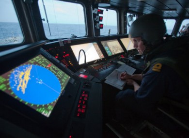 File photo of bridge crew on the Swedish warship HMSwMS Carlskrona coordinating shipping escorts and looking out for pirates off the Somali coast.