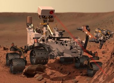 An artist's impression of the Curiosity rover at work on Mars.