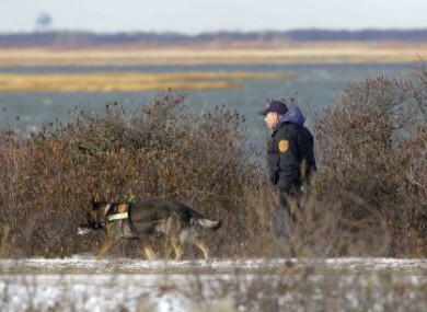 December 2010 photo of Long Island police searching the beach area where bodies were discovered.