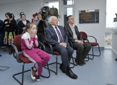 President Michael D Higgins with Megan Quinn, 10, and Joe Donoghue at the launch of an arts project in Rialto, Dublin today.