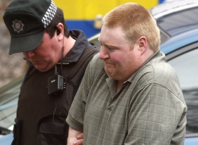 Brendan McConville, who is charged with the murder of PSNI constable Stephen Carroll, is led into court in 2009. He and John Paul Wootton, 19, will today stand trial for Carroll's murder.