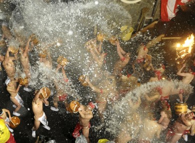 Men take part in the traditional 'splashing festival' in Naganoharamachi, Japan
