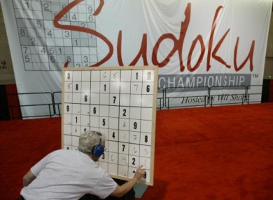 A contestant works on his puzzle in the final round during the Philadelphia Inquirer Sudoku National Championship.