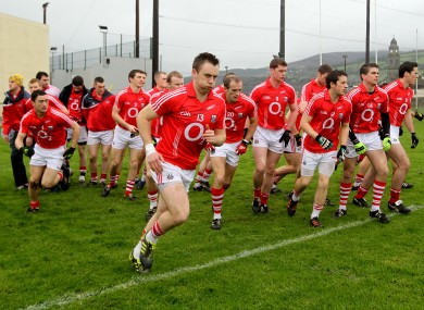 Paul Kerrigan (front) breaks from his Cork team-mates as they come out for the McGrath Cup final.