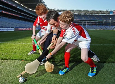 Daniel Ryan (10), left, and Matthew Ryan (9) go up against Dublin's Ryan O'Dwyer at the launch of the 2011 Kellogg's GAA Cúl Camps in Croke Park.