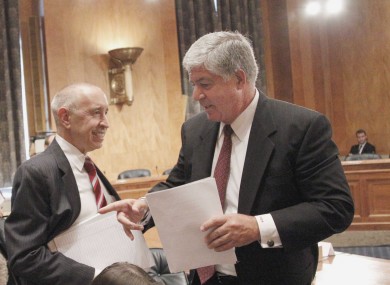 AIG chief executive Robert Benmosche (right) has had his salary frozen - but his total package is still worth around $10.5 million.