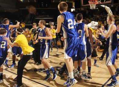 Tennessee high school players celebrate after a win in March.