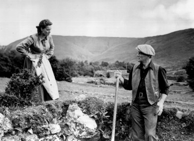 Maureen O'Hara and John Wayne converse in a scene from The Quiet Man.