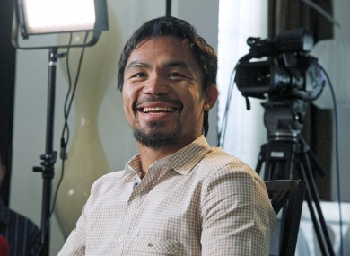 Manny Pacquiao, world champion boxer and Filipino congressman, smiles during a break while speaking about his views on same-sex marriage yesterday.