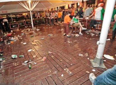 Debris is strewn around an area of the Old Market in the aftermath of last night's violence.