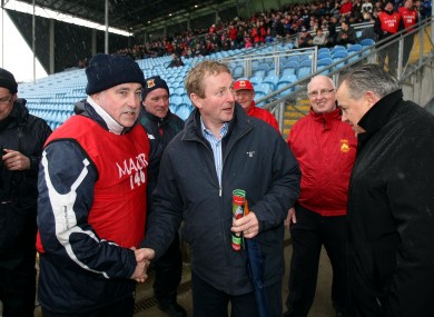 Kenny is greeted upon his arrival yesterday.